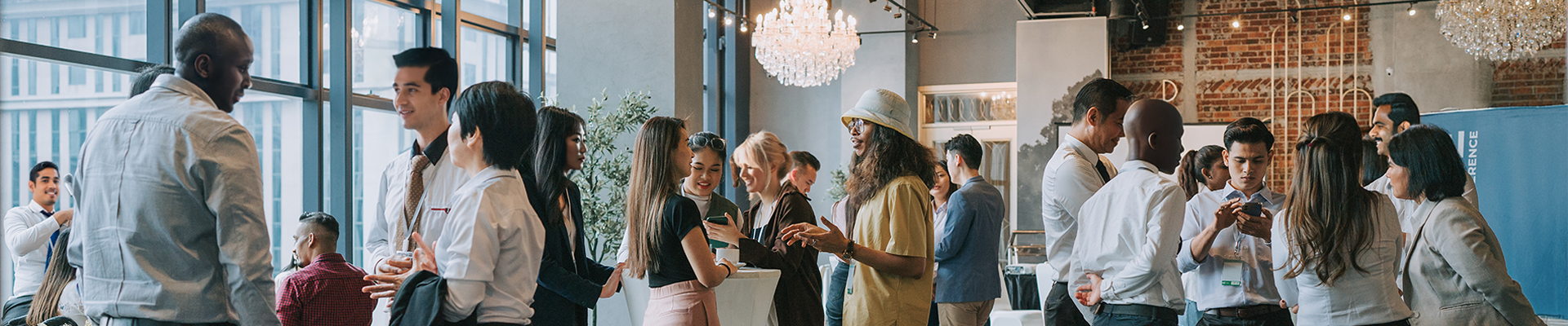 Group of individuals networking at an indoor event.